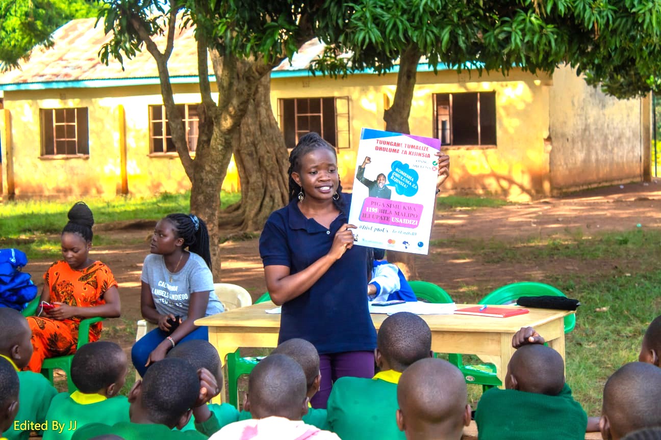 CCGD Busia County Admnistrator, Sharon Ngaira sensitizng girls at Alupe Primary School on menstrual hygiene and GBV. Photo -JJ